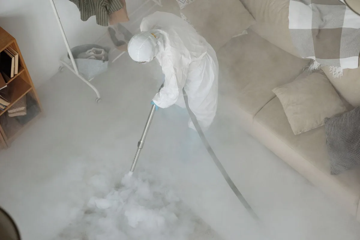 Biohazard cleanup technician in protective equipment, Moodus, CT